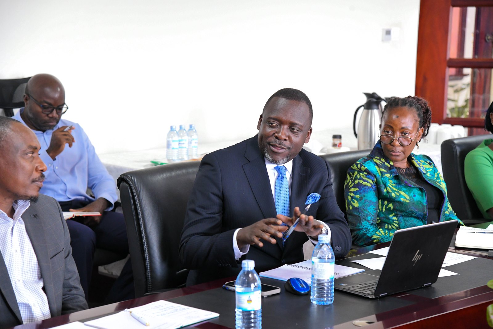 Mr. Yusuf Kiranda (Centre) flanked by Prof. Winston Tumps Ireeta (Left) and Prof. Gorettie Nabanoga (Right) contributes to the discussion. Makerere University hosts delegation from Stanbic Bank to strengthen their longstanding relationship and explore future collaborations, 26th August 2025, Kampala Uganda, East Africa.