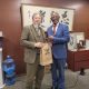 The Vice Chancellor, Prof. Barnabas Nawangwe (R) handing a gift to an official during his meeting in Japan.