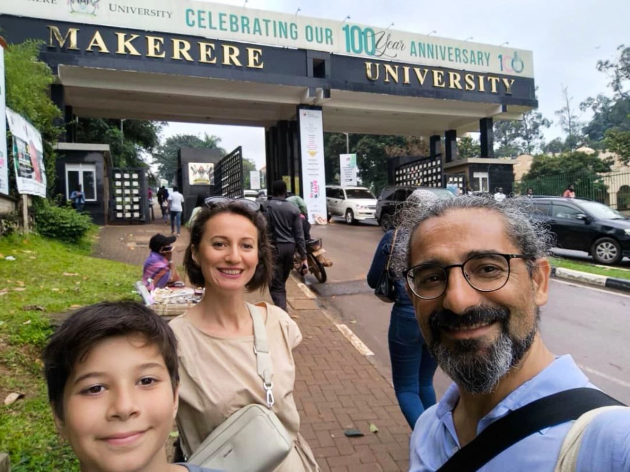 Prof. İbrahim Hakan Karataş takes a selfie with his family at the Makerere University Main Gate. Photo: LinkedIn/İbrahim Hakan Karataş. Prof. İbrahim Hakan Karataş Visiting Scholar at Makerere University and Professor at İstanbul Medeniyet University, Turkey. Time at College of Education and External Studies and farewell on 24th July 2025, Kampala Uganda, East Africa.