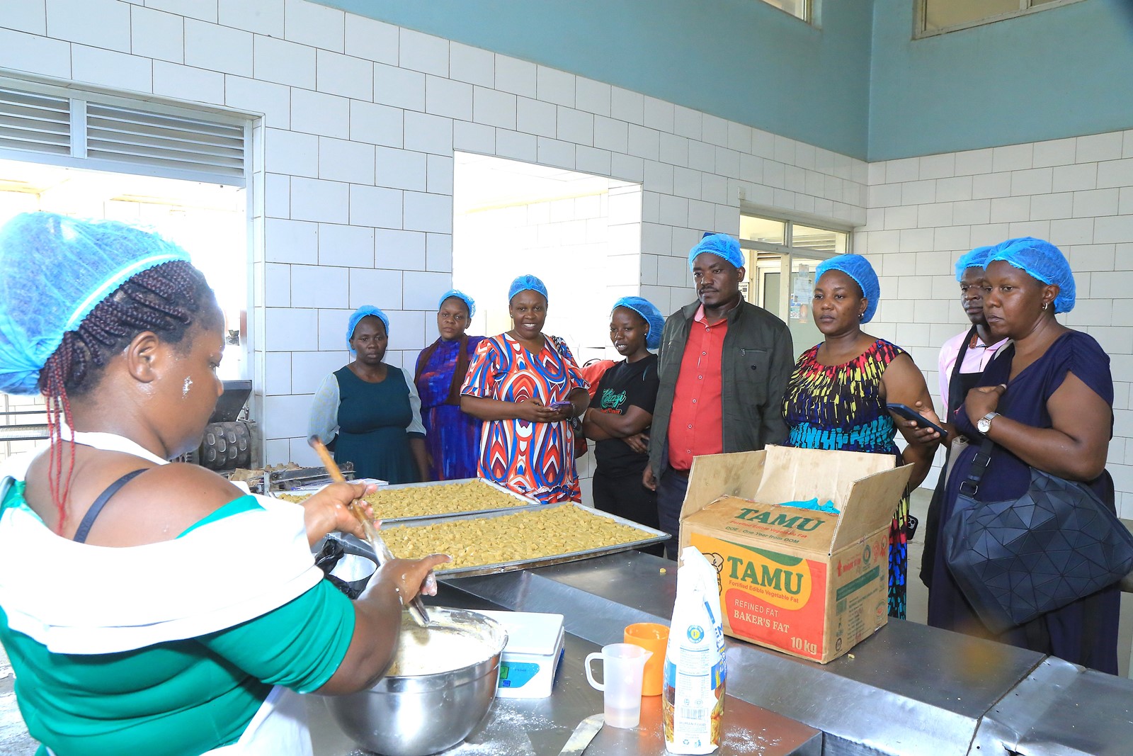 Some of processors being trained in baking. Department of Food Technology and Nutrition (DFTN) school-based nutrition awareness campaigns, diagnostic pre-visits to local food processors, and an intensive two-day hands-on training workshop held from 8th–9th September 2025 at the School of Food Technology, Nutrition, and Bioengineering (SFTNB), College of Agricultural and Environmental Sciences (CAES), Makerere University, Kampala Uganda, East Africa.