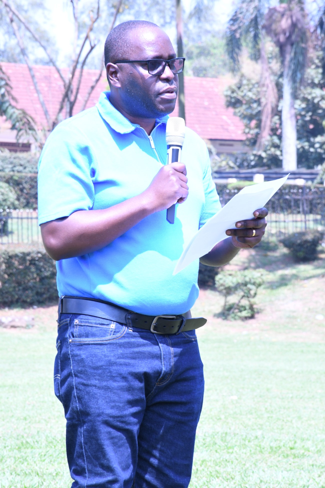 Mr. John Osuna, speaking on behalf of the Program Director, Prof. Justine Namaalwa, at the event. Mastercard Foundation Scholars Community Open Day, September 6, 2025, Freedom Square, Makerere University, Kampala Uganda, East Africa.