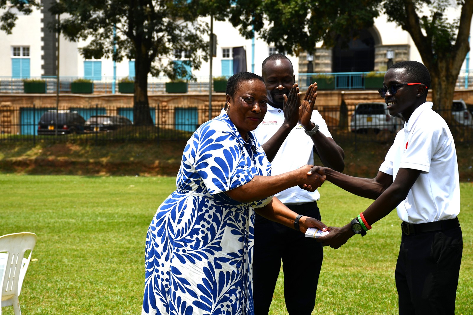 Ms. Agnes Katumba, the Director, Katumba Estates Ltd handing over part of her pledge towards the Scholars Giveback project. Mastercard Foundation Scholars Community Open Day, September 6, 2025, Freedom Square, Makerere University, Kampala Uganda, East Africa.