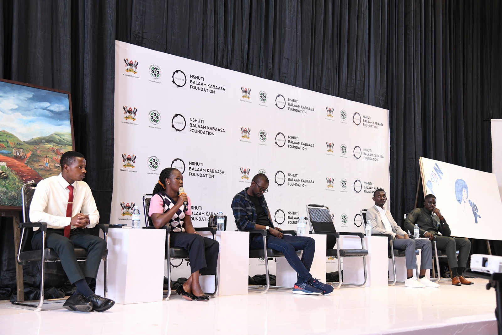 Panelists from Left to Right: Akanyihayo Joshua, Eyotaru Beatrice, Amos Desmond Wambi, Victor and Ethan Kaweesi. 3rd edition of Hadithi Ya Mzizi to celebrate the resilience and innovation of the informal sector through art exhibition and to memorialize its founder, the late Nshuti Balaam Kabaasa, 29th August 2025 Makerere University, Kampala Uganda, East Africa.