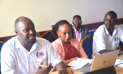 Dr. Abu Mayanja (L), the Chief Operations Officer, and other SAF staff at the meeting