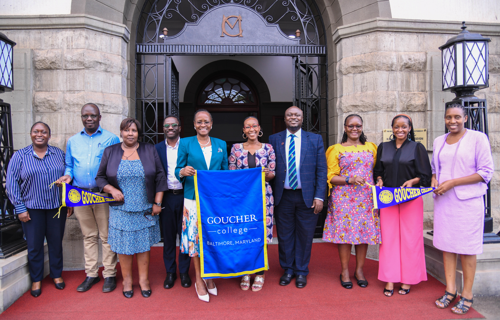 Prof. Sarah Ssali (L)and Ms. Nenelwa Tomi holding a Goucher College's banner after the engagement on 2nd Oct. 2025.