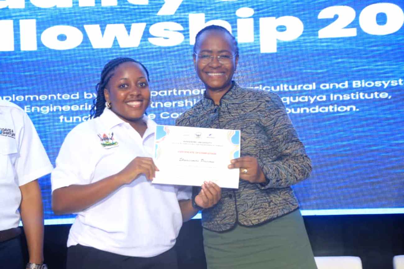 Prof. Ssali presenting a certificate to one of the trainees at the ceremony. Successful completion of training of the third cohort of the Conrad N. Hilton Africa Water Quality Testing Fellowship by Department of Agricultural and Biosystems Engineering, College of Agricultural and Environmental Sciences (CAES), Makerere University, Kampala Uganda, East Africa on 3rd October 2025.