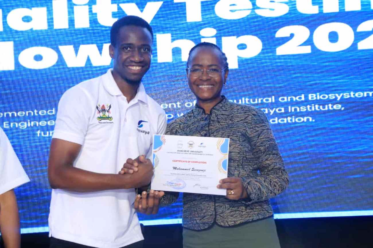 A trainee receiving his certificate at the award ceremony. Successful completion of training of the third cohort of the Conrad N. Hilton Africa Water Quality Testing Fellowship by Department of Agricultural and Biosystems Engineering, College of Agricultural and Environmental Sciences (CAES), Makerere University, Kampala Uganda, East Africa on 3rd October 2025.