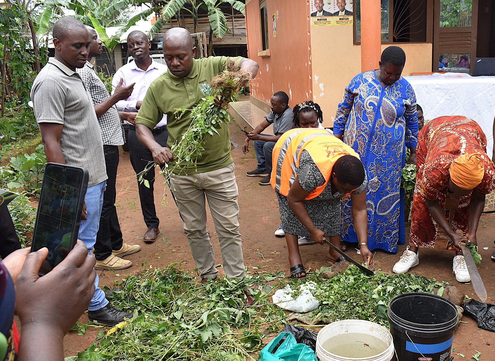 The farmers practicing to make fertilizers. Phase II of the Resilient Urban Food Systems (RUFS) Project, Department of Geography, Geo-Informatics, and Climatic Sciences at Makerere University, Kampala Uganda, East Africa and funded through the AgriFoSe2030 Programme, practical techniques for producing organic fertilizers and pesticides using affordable, locally available materials 6th to 7th October 2025, Emily Royal Mixed Farm, Industrial City Division, Mbale City.