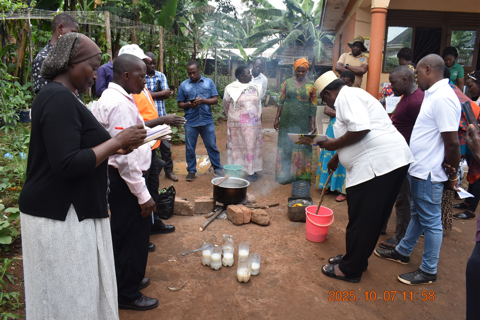 Mr. Mbowa training the farmers on the use of ash in the production of pesticides. Phase II of the Resilient Urban Food Systems (RUFS) Project, Department of Geography, Geo-Informatics, and Climatic Sciences at Makerere University, Kampala Uganda, East Africa and funded through the AgriFoSe2030 Programme, practical techniques for producing organic fertilizers and pesticides using affordable, locally available materials 6th to 7th October 2025, Emily Royal Mixed Farm, Industrial City Division, Mbale City.