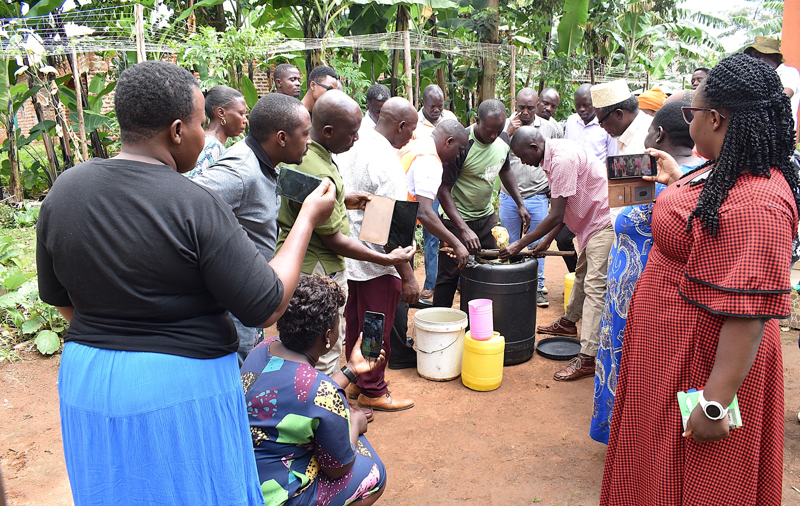 Mr. Henry Stanely Mbowa taking the farmers through the process of producing fertilizers using cow dung. Phase II of the Resilient Urban Food Systems (RUFS) Project, Department of Geography, Geo-Informatics, and Climatic Sciences at Makerere University, Kampala Uganda, East Africa and funded through the AgriFoSe2030 Programme, practical techniques for producing organic fertilizers and pesticides using affordable, locally available materials 6th to 7th October 2025, Emily Royal Mixed Farm, Industrial City Division, Mbale City.