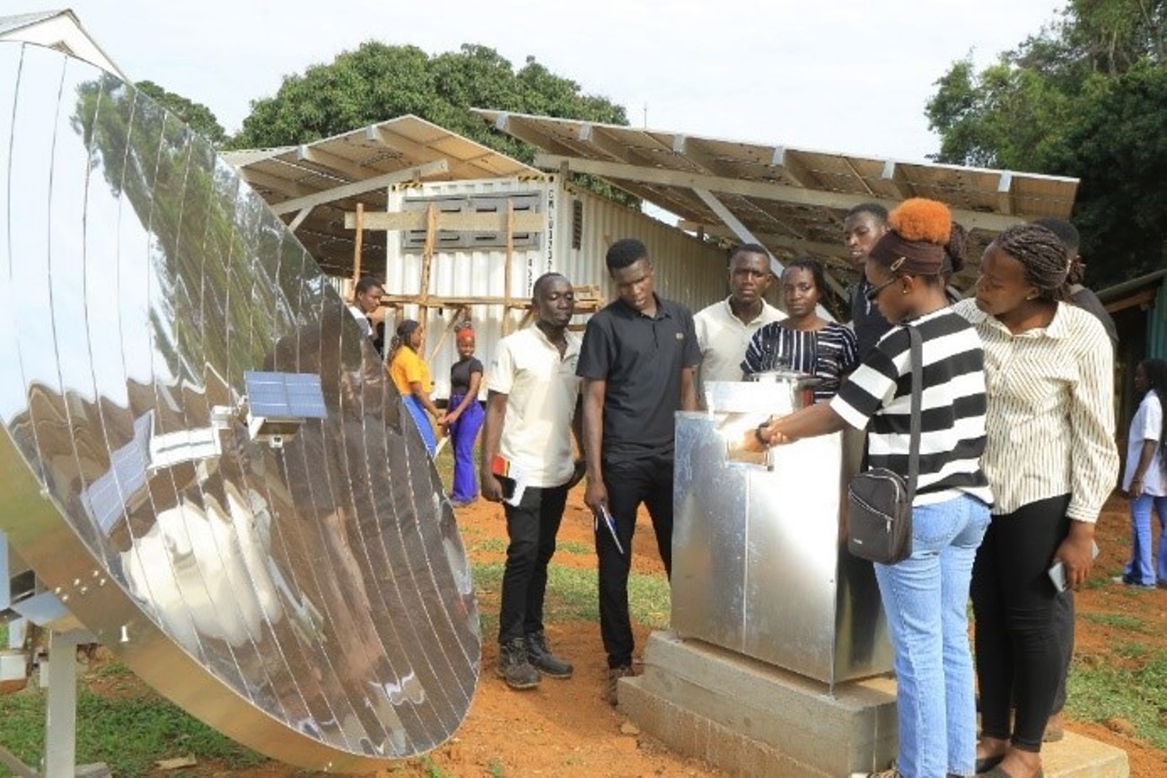 Makerere University students using Scheffler dish concentrators to make popcorn. Sustainable Off-Grid Solutions for Pharmacies and Hospitals in Africa (SophiA) Project facility at Buvuma Health Centre IV official commissioning by the Vice Chancellor of Makerere University, Kampala Uganda, East Africa represented by Dr. Julia Kigozi on 30th September 2025.