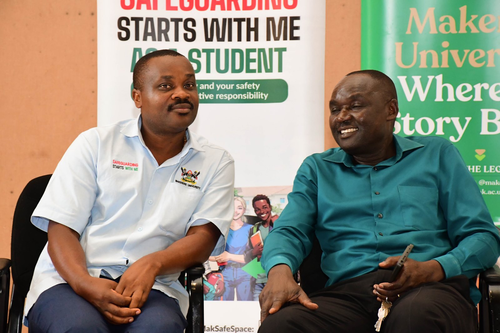 L-R: Dr. Taddeo Masimengo and Mr. Joseph Ikarokok some of the CoBAMS staff Safeguarding Champions. Powerful campaign themed “Safeguarding Starts With Me”, Organized by the Office of the Dean of Students in partnership with the Mastercard Foundation Scholars Program and the College of Business and Management Sciences (CoBAMS), 13th October 2025, Yusuf Lule Central Teaching Facility Auditorium, Makerere University, Kampala Uganda, East Africa.