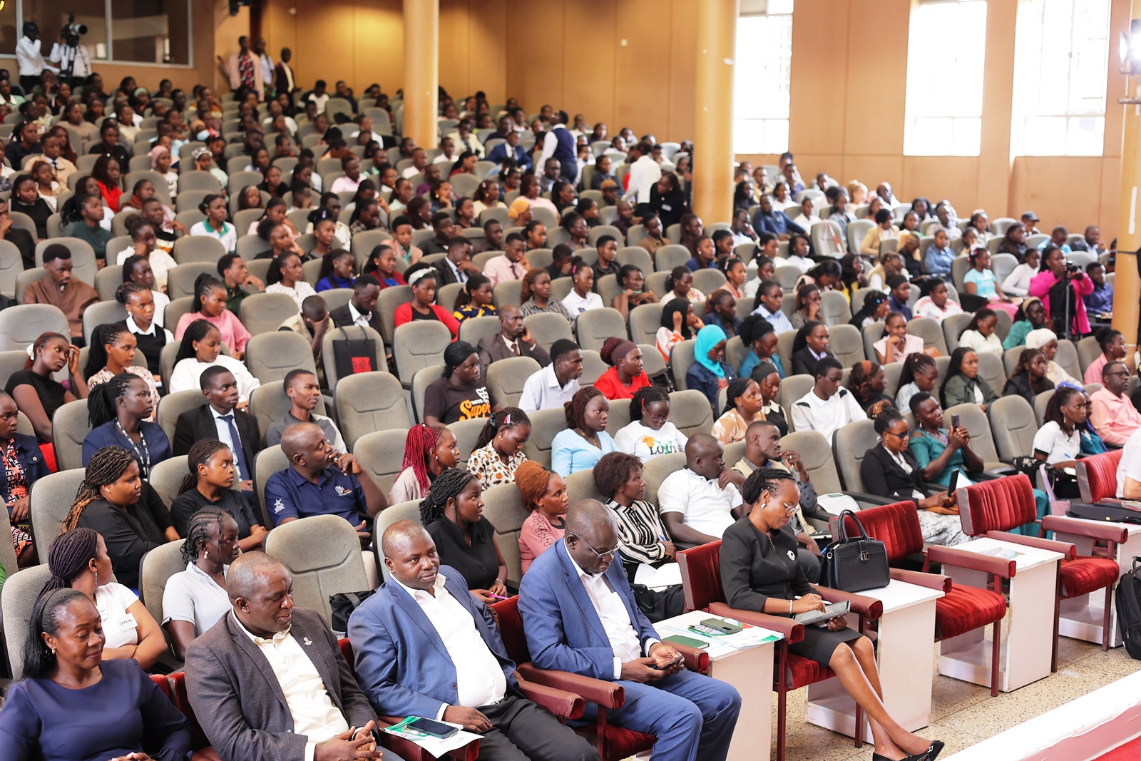 Students (in the background) participating in the Uganda Entrepreneurship Congress on 16th October 2025. 9th Annual Innovation and Youth Expo organized by the Makerere University Entrepreneurship and Outreach Centre, College of Business and Management Sciences (CoBAMS), Under the theme, Brewing Prosperity: Youth Entrepreneurship in Uganda’s Coffee Value Chain, 600 student entrepreneurs exhibited more than 300 innovations, 16th-17th October 2025, Yusuf Lule Central Teaching Facility Auditorium and Freedom Square, Kampala Uganda, East Africa.