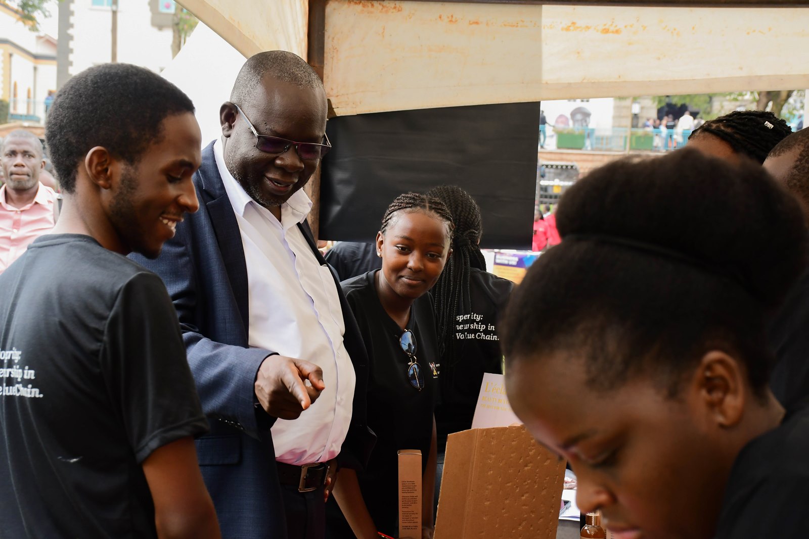The Dean, School of Business, Associate Professor Godfrey Akileng interacting with the student entrepreneurs at the Expo. 9th Annual Innovation and Youth Expo organized by the Makerere University Entrepreneurship and Outreach Centre, College of Business and Management Sciences (CoBAMS), Under the theme, Brewing Prosperity: Youth Entrepreneurship in Uganda’s Coffee Value Chain, 600 student entrepreneurs exhibited more than 300 innovations, 16th-17th October 2025, Yusuf Lule Central Teaching Facility Auditorium and Freedom Square, Kampala Uganda, East Africa.