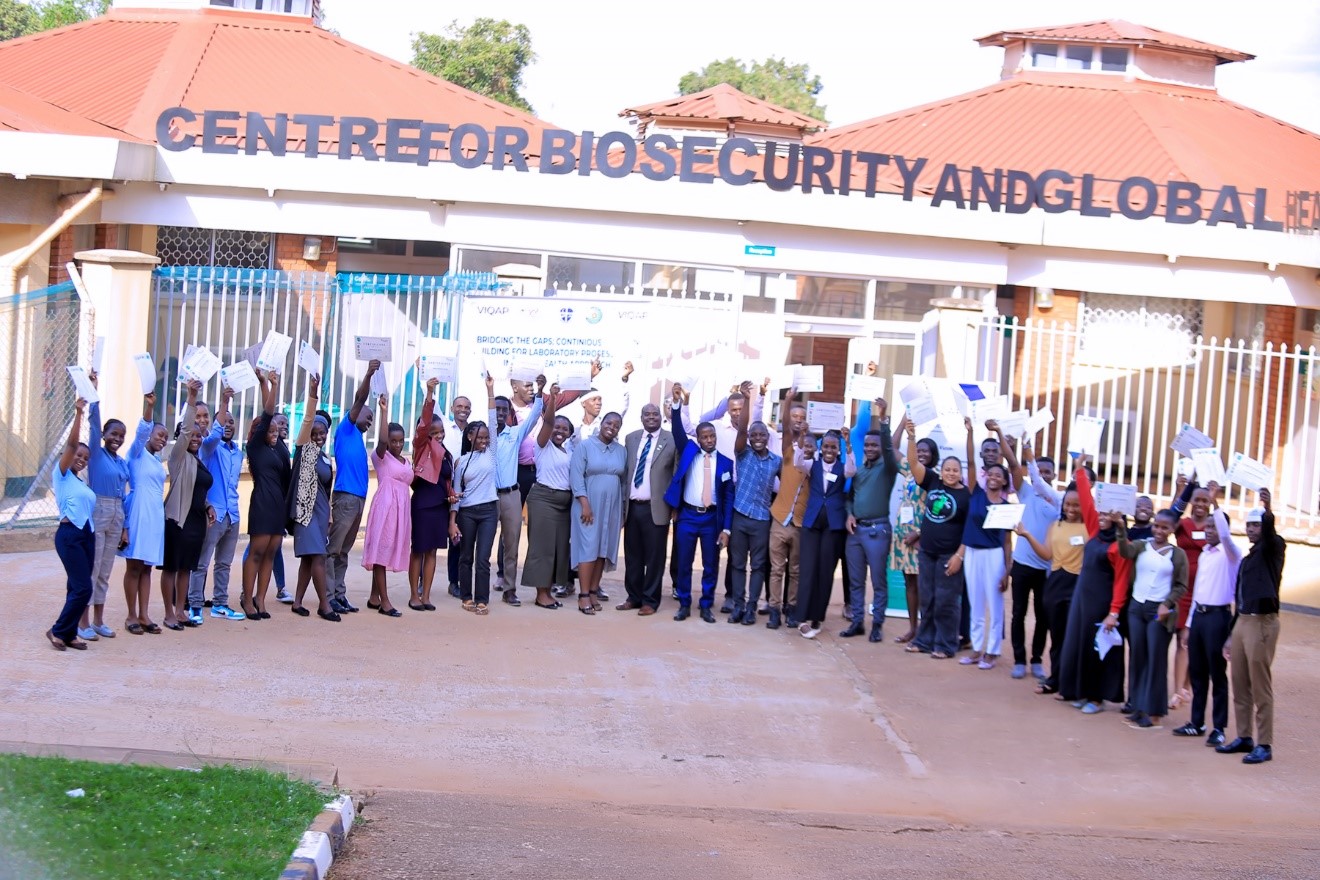 Participants posing for a photo after the training. Centre for Biosecurity and Global Health (CeBIGH) and the Department of Biosecurity, Ecosystems and Veterinary Public Health (BEP) in collaboration with VIQAP Consultancy Services, the Uganda Medical Laboratory Technologists Association (UMLTA), the Biosafety and Biosecurity Association of Uganda (BBAU), and the Uganda National Health Laboratories and Diagnostic Services, conducted a three-day Biorisk Management (Biosafety and Biosecurity) training, 20th to 22nd October 2025 at COVAB, Makerere University, Kampala Uganda, East Africa.