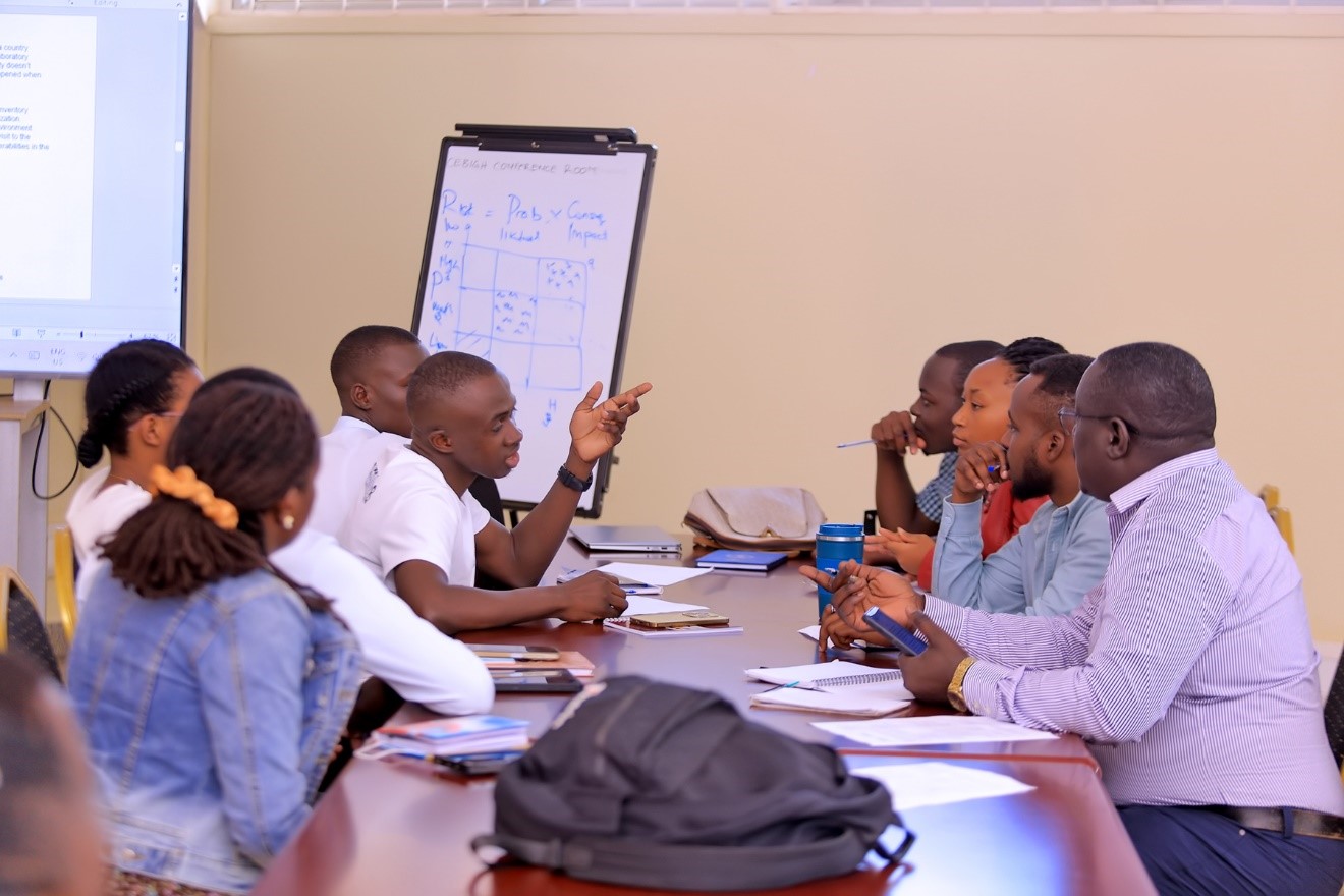 Participants in a group discussion during the training. Centre for Biosecurity and Global Health (CeBIGH) and the Department of Biosecurity, Ecosystems and Veterinary Public Health (BEP) in collaboration with VIQAP Consultancy Services, the Uganda Medical Laboratory Technologists Association (UMLTA), the Biosafety and Biosecurity Association of Uganda (BBAU), and the Uganda National Health Laboratories and Diagnostic Services, conducted a three-day Biorisk Management (Biosafety and Biosecurity) training, 20th to 22nd October 2025 at COVAB, Makerere University, Kampala Uganda, East Africa.