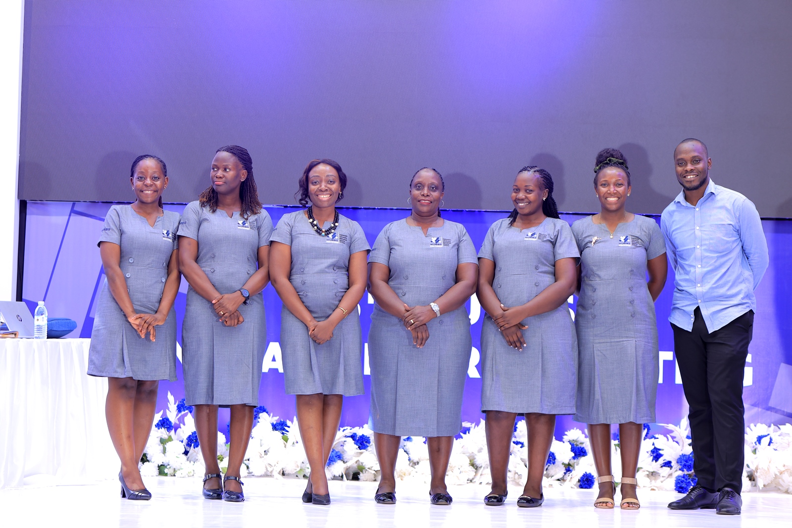 The Principal Pension Officer (3rd Left) with Members of the Secretariat Left to Right: Ms. Rebecca Nairuba, Ms. Juliet Nabukeera, Ms. Rhona Asingwiire, Ms. Doreen Namono, Ms. Julian Marembo, and Mr. Marvin Kakumba. Makerere University Retirement Benefits Scheme (MURBS) Board of Trustees on 23rd October 2025 during the 15th Annual General Meeting declared an interest on 13.56% on Members balances for the Financial Year 2024/2025. Main Hall, Main Building, Kampala Uganda, East Africa.