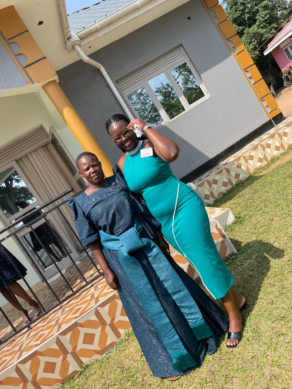 Malvin with her mother. In the background is the decent home she constructed for her. Impact Stories: Meet Malvin Akwara, a Mastercard Foundation Scholars Program alumnus, who is dedicated to promoting inclusive education, October 2025, Makerere University, Kampala Uganda, East Africa.