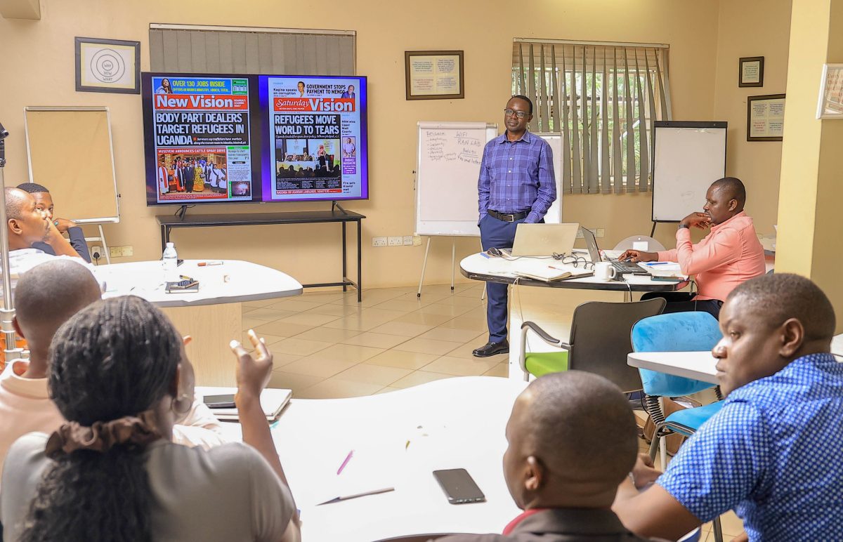 Media trainer Mr. Wilson Akiiki Kaija facilitates a session on “Centring Humanity” during the Refugee Health and Migration Reporting Workshop at MakSPH, underscoring the media’s role in advancing accuracy, dignity, and context in refugee reporting. October 3, 2025. Media Training Workshop on Refugee Health and Migration Reporting that brought together twenty journalists from Kampala, Kyaka II, Adjumani, and other refugee-hosting districts, Makerere University School of Public Health (MakSPH), Kampala Uganda, East Africa on 3rd October 2025.