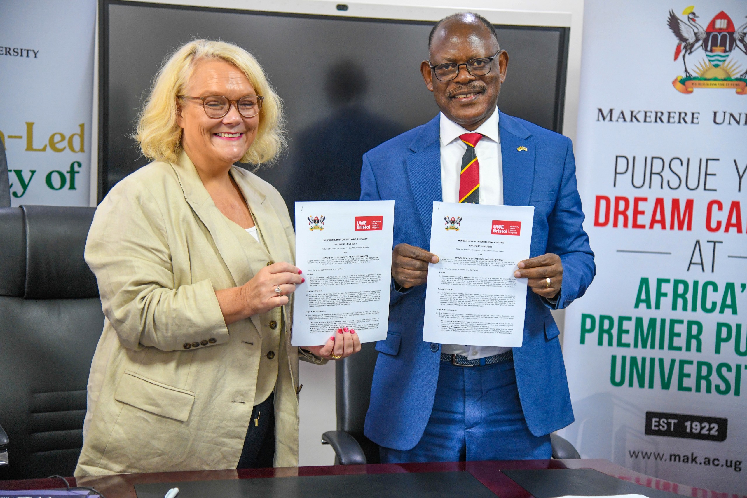 Prof. Barnabas Nawangwe (R) and Ms. Jo Midgley (L) display the signed MoU. Makerere University and the University of the West of England (UWE) sign MoU aimed at strengthening collaboration in research, innovation, and enterprise development, 17th October 2025, Main Building, Kampala Uganda, East Africa.