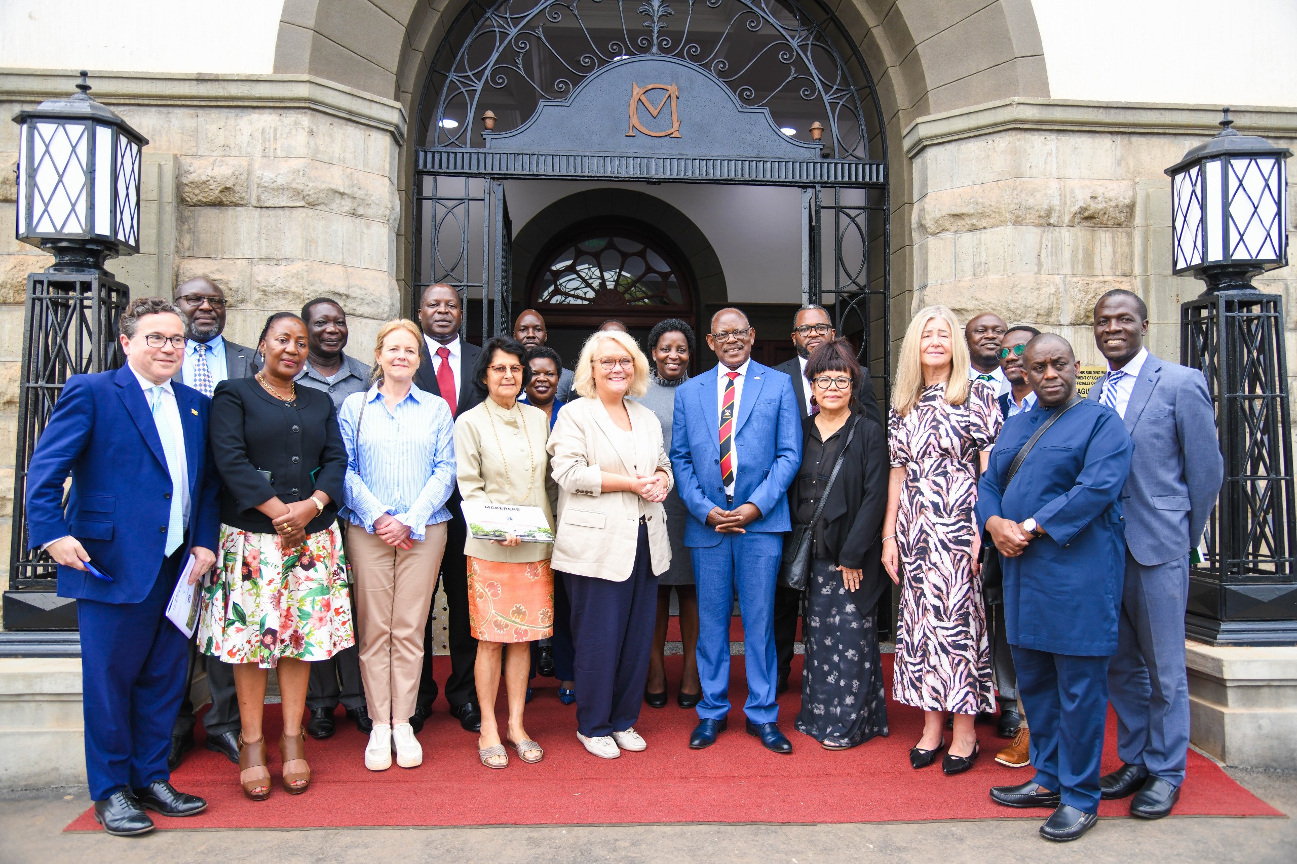 Officials from Makerere and UWE pose for a group photo at the Main Building Entrance after the MoU signing. Makerere University and the University of the West of England (UWE) sign MoU aimed at strengthening collaboration in research, innovation, and enterprise development, 17th October 2025, Main Building, Kampala Uganda, East Africa.