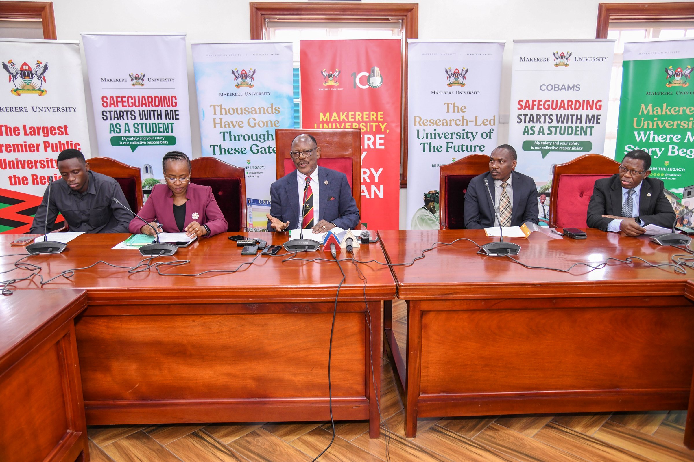 Vice Chancellor-Prof. Barnabas Nawangwe (C) flanked by DVCAA-Prof. Sarah Ssali (2nd L), Ag. DVCFA-Prof. Winston Tumps Ireeta (2nd R), AR-Prof. Buyinza Mukadasi (R) and Guild President-H.E. Ssentamu Churchill James (L) at the press briefing on 7th October 2025. Council Room, Main Building, Makerere University, Kampala Uganda, East Africa.
