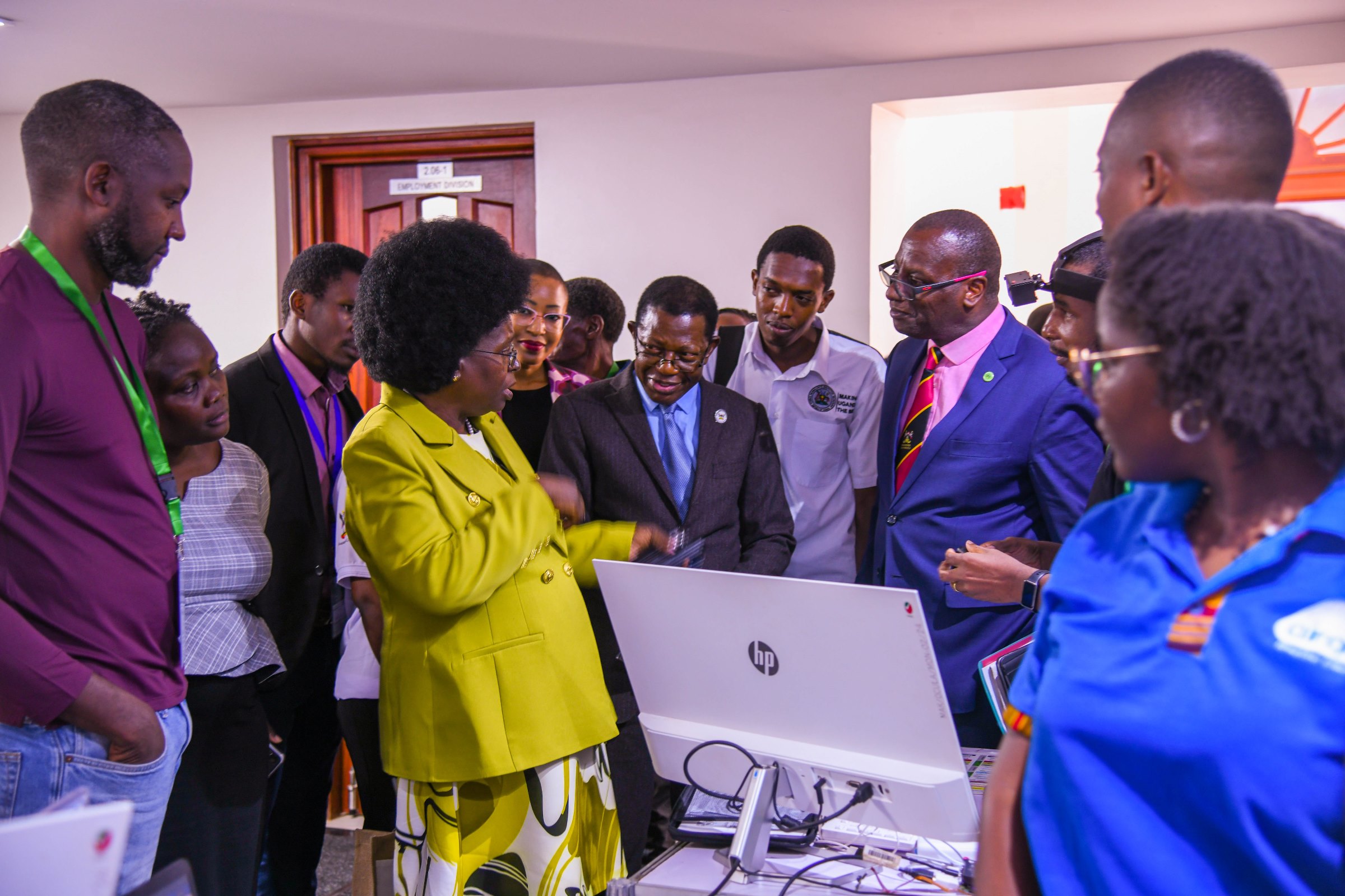 Hon. Dr. Monica Musenero interacts with officials and exhibitors. 2nd Artificial Intelligence (AI) in Health Africa Conference under theme “Setting AI for Sustainable and Inclusive Health Systems in Africa”, Opening Ceremony 6th November 2025, Main Hall, Makerere University, Kampala Uganda, East Africa.