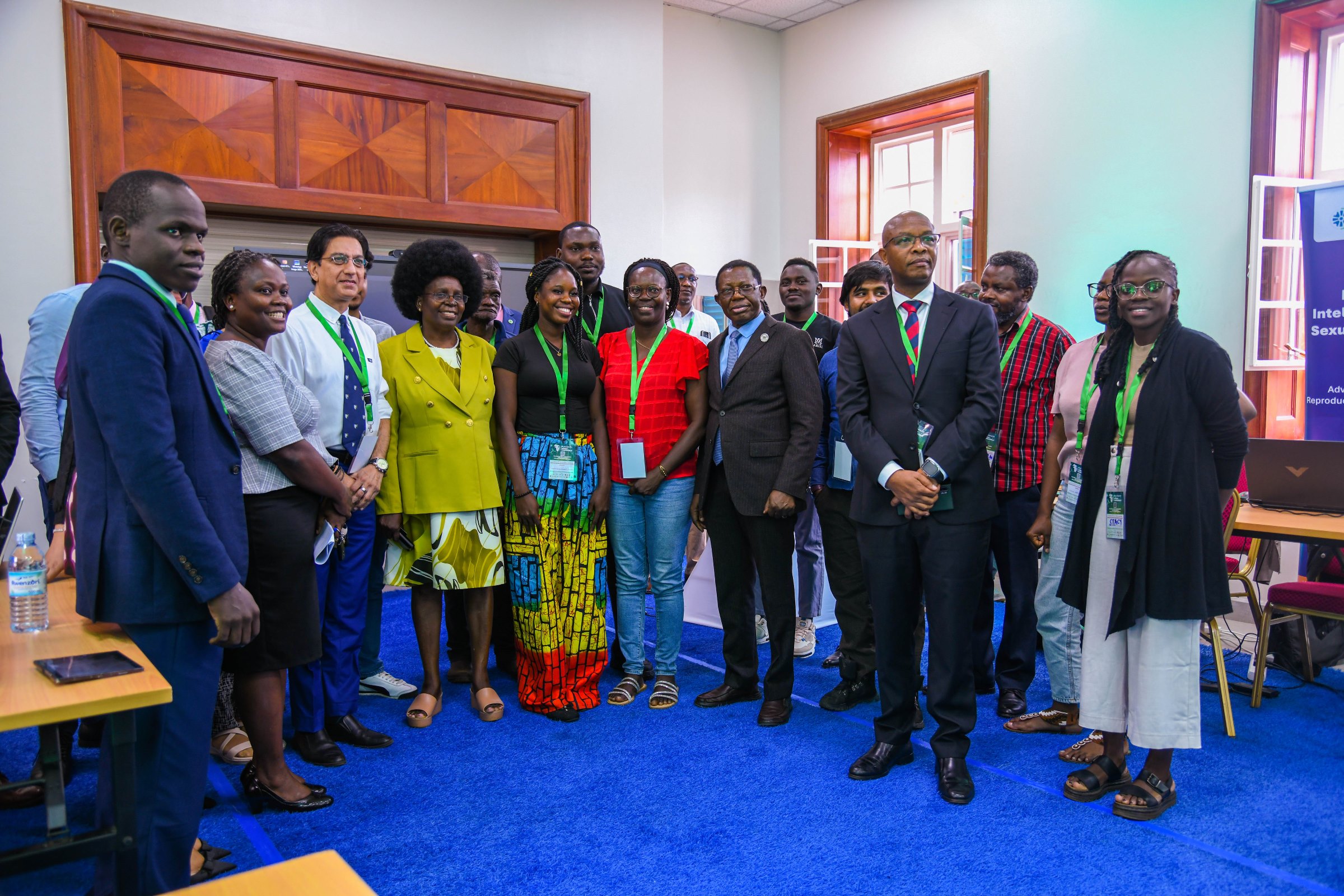Hon. Dr. Monica Musenero (Centre) with exhibitors after the official opening ceremony. 2nd Artificial Intelligence (AI) in Health Africa Conference under theme “Setting AI for Sustainable and Inclusive Health Systems in Africa”, Opening Ceremony 6th November 2025, Main Hall, Makerere University, Kampala Uganda, East Africa.