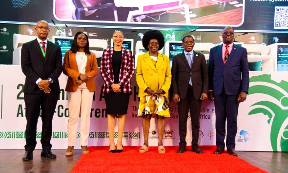 Hon. Dr. Monica Musenero (3rd Right) flanked by Left to Right: Mr. Ambrose Ruyooka, Dr. Rose Nakasi, Dr. Stella Kivila, Prof. Buyinza Mukadasi and Dr. Andrew Kambugu at the Conference Opening Ceremony on 6th November 2025. 2nd Artificial Intelligence (AI) in Health Africa Conference under theme “Setting AI for Sustainable and Inclusive Health Systems in Africa”, Opening Ceremony 6th November 2025, Main Hall, Makerere University, Kampala Uganda, East Africa.