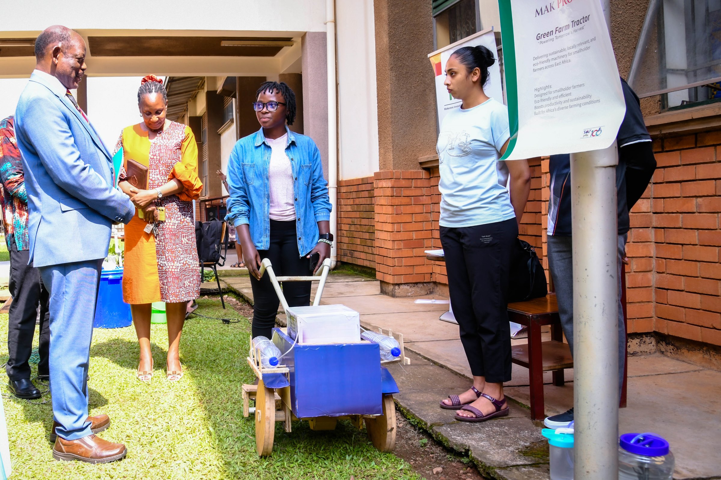 Prof. Nawangwe (Left) interacts with the Green Farm Tractor Team. School of Food Technology, Nutrition and Bio-Engineering (SFTNB), in partnership with the Makerere Innovation and Incubation Center (MIIC), third edition of Entrepreneurship Exhibition on 12th November 2025, College of Agricultural and Environmental Sciences (CAES), Makerere University, Kampala Uganda, East Africa.