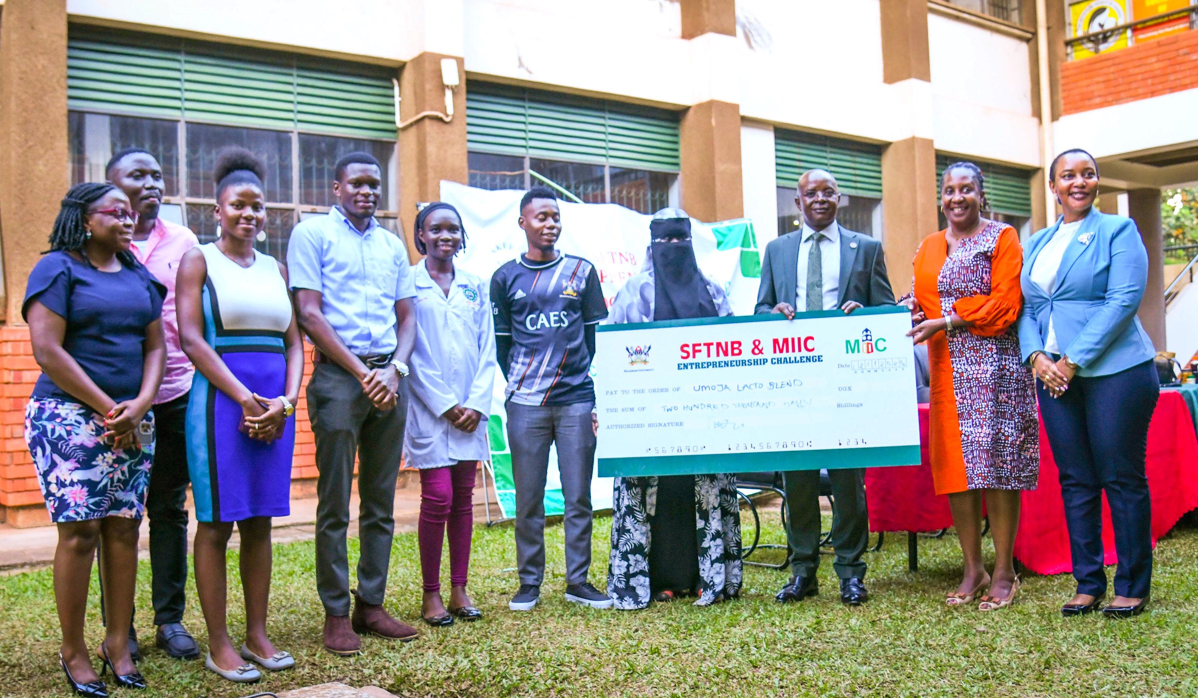 Prof. Bbaale and officials present the Second Runner-Up award to Team Umoja Lacto Blend. School of Food Technology, Nutrition and Bio-Engineering (SFTNB), in partnership with the Makerere Innovation and Incubation Center (MIIC), third edition of Entrepreneurship Exhibition on 12th November 2025, College of Agricultural and Environmental Sciences (CAES), Makerere University, Kampala Uganda, East Africa.