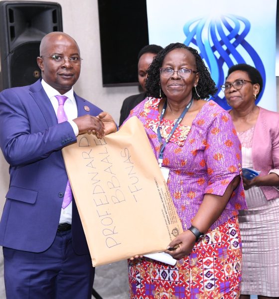 The President UNAS Council-Prof. Grace Bantebya Kyomuhendo (Right) presents induction documentation to Prof. Edward Bbaale (Left) as Council Members (Background) witness on 31st October 2025. Professor Edward Bbaale, Principal of the College of Business and Management Sciences (CoBAMS), Makerere University, inducted into the prestigious fellowship of the Uganda National Academy of Sciences (UNAS), 31st October 2025, Kampala Uganda, East Africa.