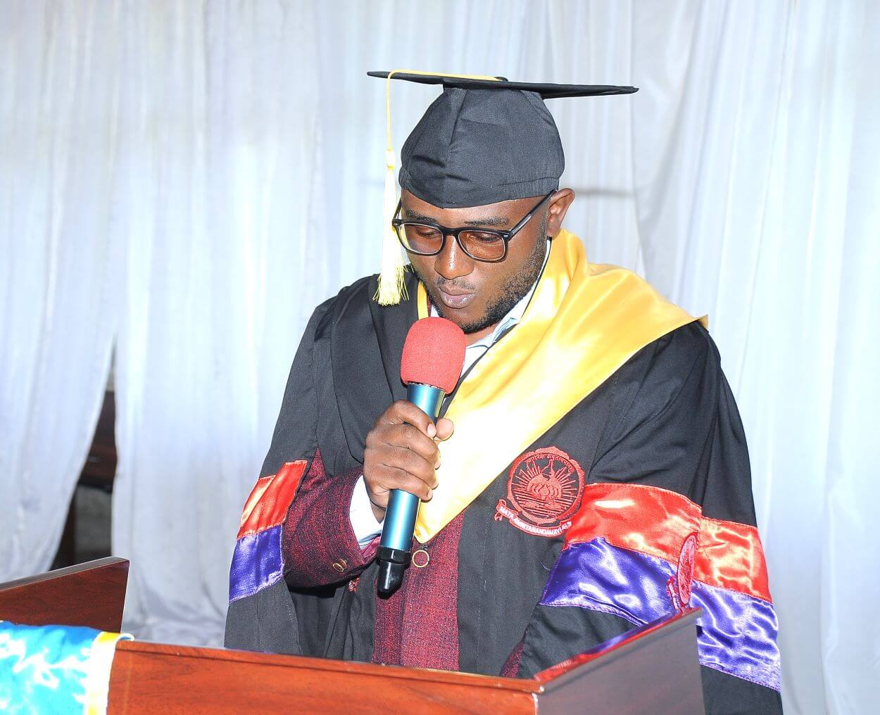 Joshua Mugabi representing graduands of Amity University. College of Computing and Information Sciences (CoCIS) graduates 71 students under Phase 2 of the e-VBAB Project, a collaboration between Amity University in India and Makerere University, presided over by Principal Prof. Tonny Oyana on behalf of the Vice Chancellor, Block B CoCIS, 21st November 2025, Kampala Uganda, East Africa.