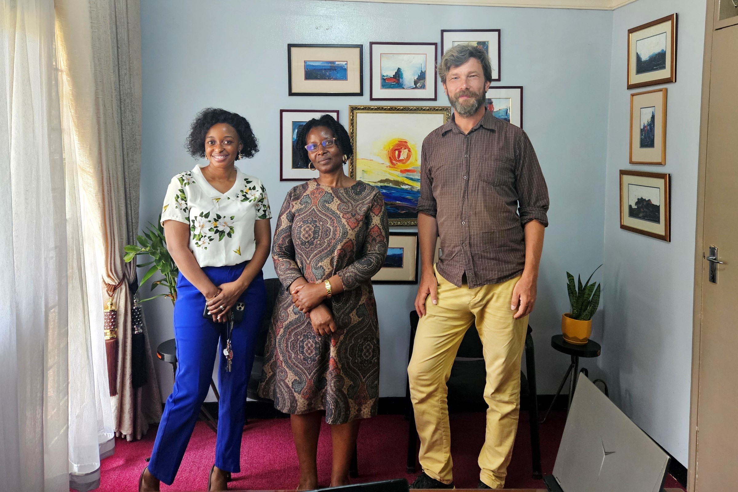 Dr. Tomasz Padło (Right) with the Dean Margaret Trowel School of Industrial and Fine Art (MTSIFA) Assoc. Prof. Amanda Tumusiime (Centre) and the International Relations Office's Ms. Betty Nabisubi (Left). Dr. Tomasz Padło, Erasmus Exchange Professor from UKEN, Poland won first prize in the prestigious Grand Press Photo 2025 competition in the Culture – Single category for a photo he took at Makerere University, Kampala Uganda, East Africa during his exchange visit.