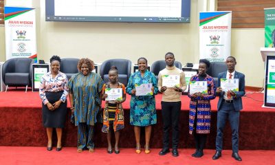 The five JNLC-UNDP Alumni Community Innovation Winners pose for a group photo with Dr. Nansozi K. Muwanga-Executive Director of JNLC and Ms. Annet Mpabulungi Wakabi-Team Leader, Governance and Peace, UNDP. Julius Nyerere Leadership Centre (JNLC) at Makerere University, in partnership with the United Nations Development Programme (UNDP), two-day Community Innovation Showcase and Alumni Workshop 18th November 2025, School of Public Health Auditorium, Kampala Uganda, East Africa. An event dedicated to strengthening alumni-led community transformation across Uganda.