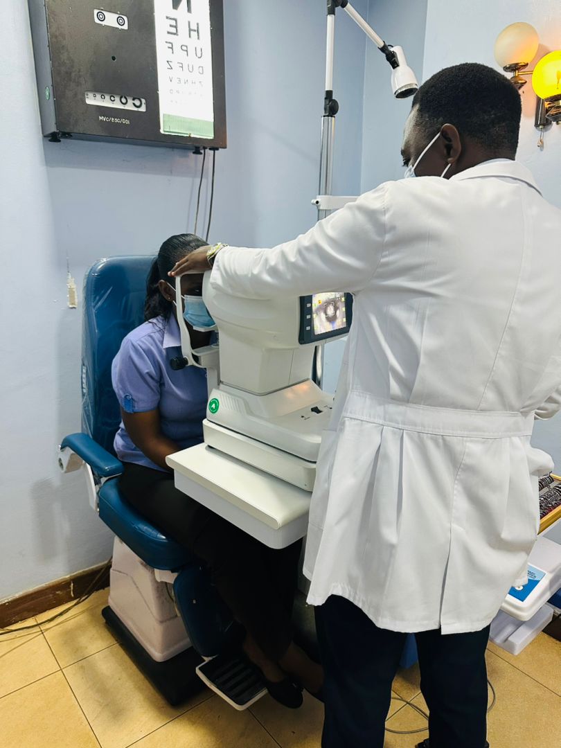 Dr. Ekwaro examining a patient at Mengo Hospital's eye Department. Impact Stories: Dr Ekwaro Ronald, Mastercard Foundation Scholars Program alumnus, Optometrist, committed to enhancing eye health in Uganda. He plans to establish the country's first Myopia Control Centre, dedicated to safeguarding the eye health of young people in Uganda and neighbouring nations, November 2025, Makerere University, Kampala Uganda, East Africa, November 2025, Kampala Uganda, East Africa.