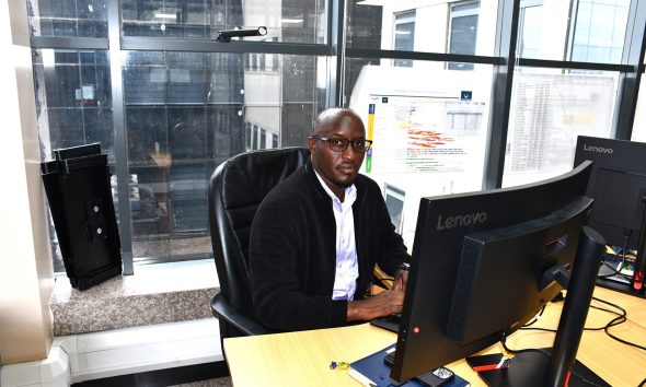 Sedrik at his workstation at the Petroleum Authority of Uganda. Impact Stories: Sedrick Nuwagaba, a 35-year-old petroleum engineer and Mastercard Foundation Scholars Program alumnus actively contributing his expertise to the Petroleum Authority of Uganda, November 2025, Makerere University, Kampala Uganda, East Africa.