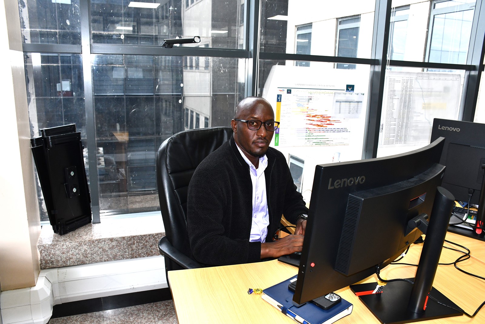 Sedrik at his workstation at the Petroleum Authority of Uganda. Impact Stories: Sedrick Nuwagaba, a 35-year-old petroleum engineer and Mastercard Foundation Scholars Program alumnus actively contributing his expertise to the Petroleum Authority of Uganda, November 2025, Makerere University, Kampala Uganda, East Africa.