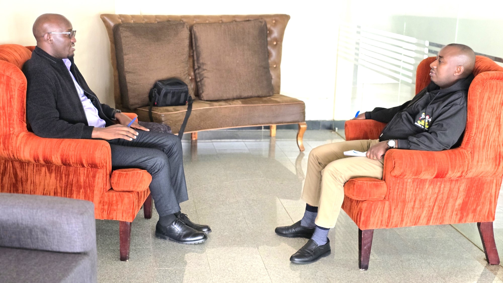 Sedrik having the interview with Mr. Bernard Buteera, the Principal Communication Officer for the Scholars Program at Makerere. Impact Stories: Sedrick Nuwagaba, a 35-year-old petroleum engineer and Mastercard Foundation Scholars Program alumnus actively contributing his expertise to the Petroleum Authority of Uganda, November 2025, Makerere University, Kampala Uganda, East Africa.