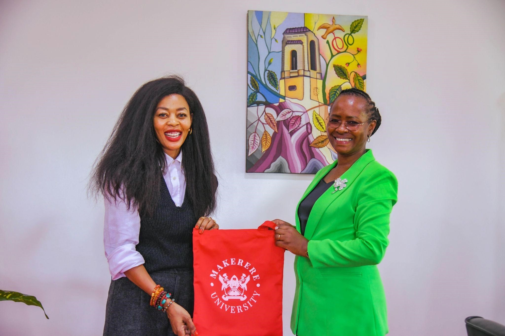 Prof. Sarah Ssali gifts Amb. Judyth a Makerere Souvenir. Makerere University, in a Top Management meeting chaired by Prof. Sarah Ssali, the Acting Vice Chancellor, hosted an important engagement with Uganda’s Consul General to China, Amb. Judyth Nsababera, 26th November 2025, Main Building, Kampala Uganda, East Africa.
