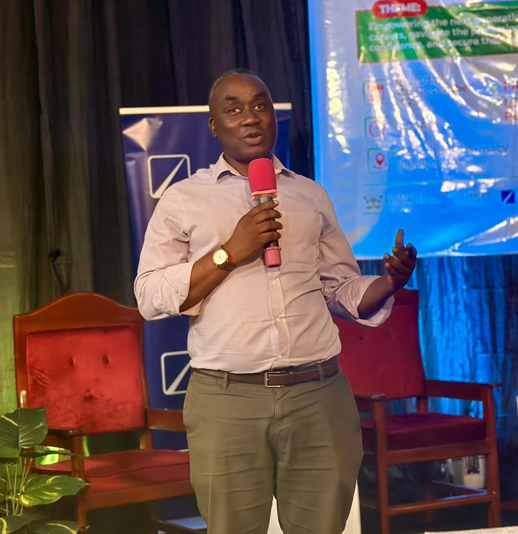 Mr. Awel Uwihanganye addressing the students at the Symposium. Career & Financial Literacy Symposium, hosted by the 91st Students’ Guild, in partnership with the Makerere Advancement Office and the DFCU Foundation for Finalists, 4th December 2025, Department of Pharmacy Auditorium, Makerere University Kampala Uganda, East Africa.
