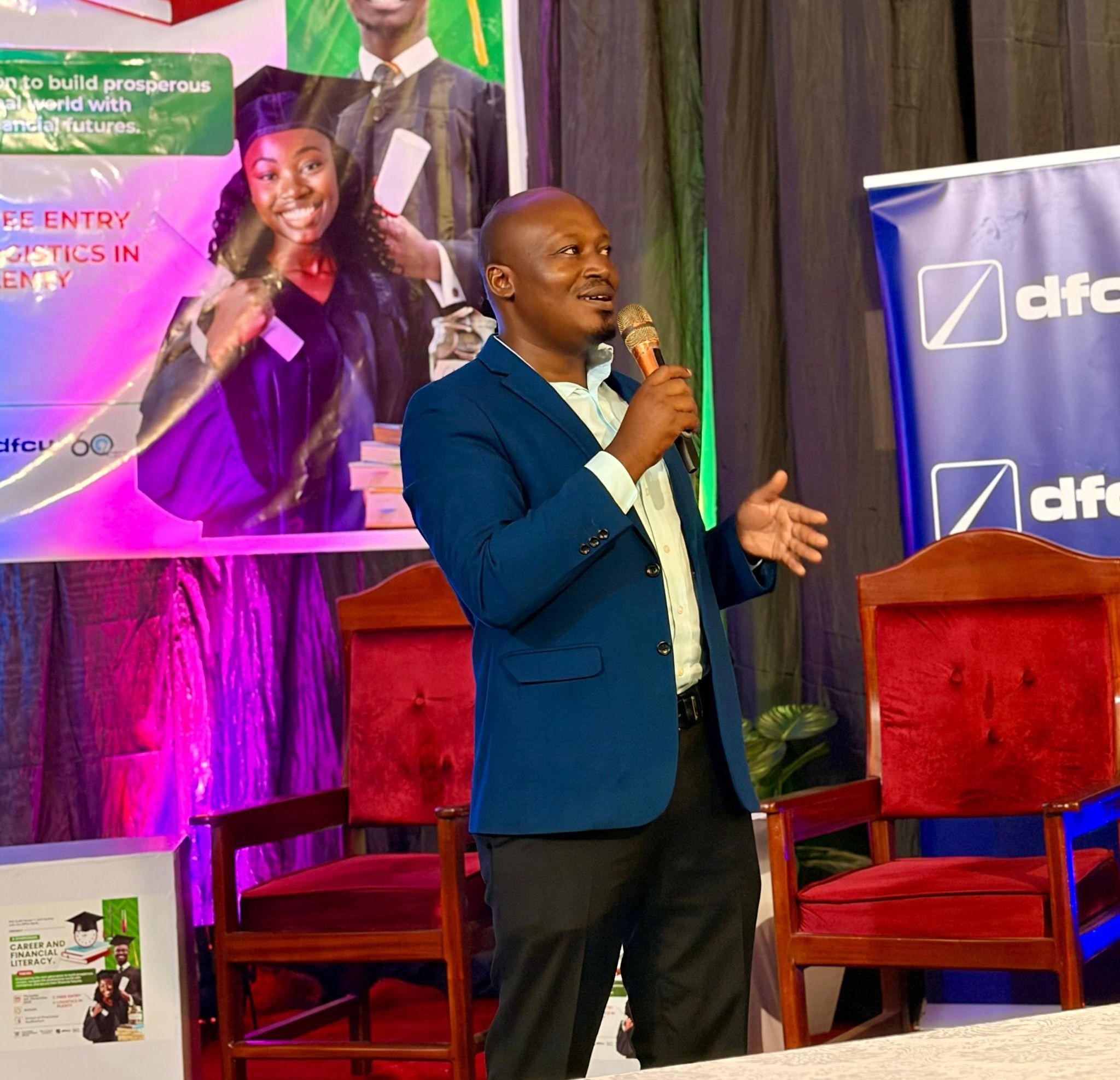Dr. Rodney Rugyema giving his remarks during the symposium. Career & Financial Literacy Symposium, hosted by the 91st Students’ Guild, in partnership with the Makerere Advancement Office and the DFCU Foundation for Finalists, 4th December 2025, Department of Pharmacy Auditorium, Makerere University Kampala Uganda, East Africa.