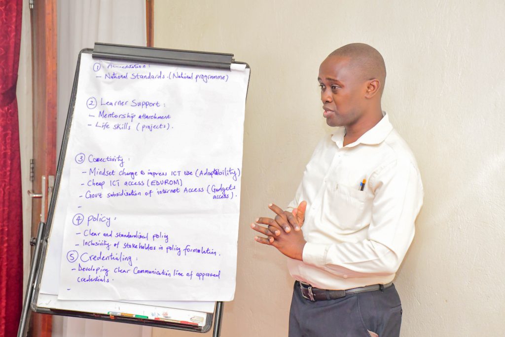 Dr. Derrick Ssekajugo, Chair of the Special Purpose Committee on Academics and Acting Principal of the College of Economics and Management at Kampala International University giving his presentation at the workshop. Delphi workshop providing a collaborative platform for dialogue on standardisation and harmonisation of Higher Education Access Programmes (HEAP) across institutions, alongside strategies for portability and verification on demand through a HEAP Digital Passport funded by Education Beyond Borders, conducted by researchers from Makerere University and the University of Edinburgh convened 17th December 2025, Kampala Kolping Hotel, Uganda, East Africa.