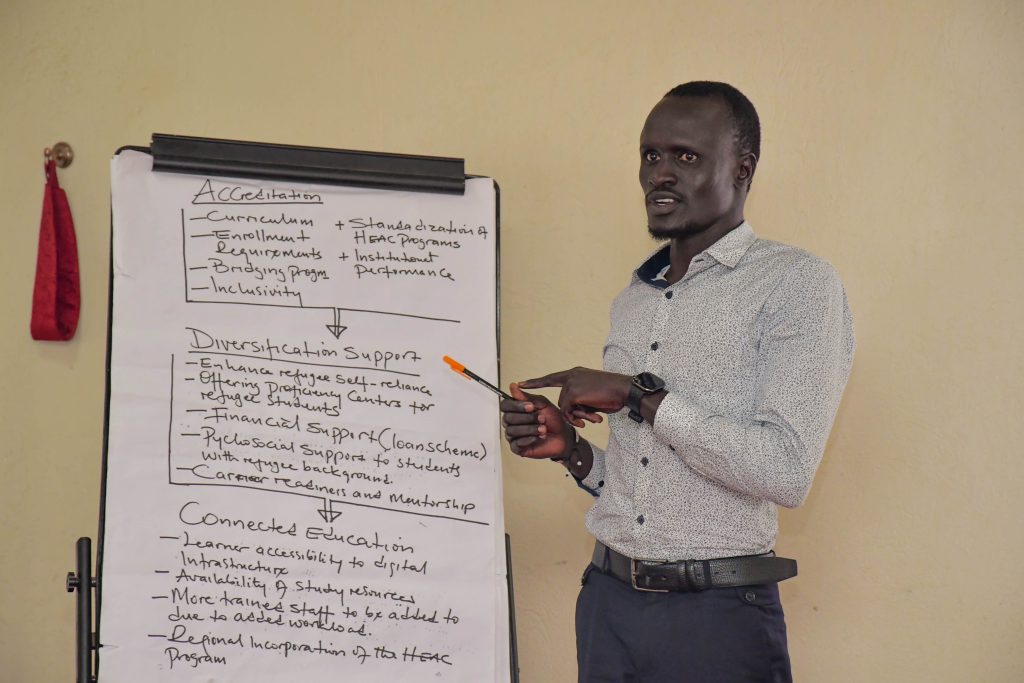A University student participant presenting issues faced by students with refugee status. Delphi workshop providing a collaborative platform for dialogue on standardisation and harmonisation of Higher Education Access Programmes (HEAP) across institutions, alongside strategies for portability and verification on demand through a HEAP Digital Passport funded by Education Beyond Borders, conducted by researchers from Makerere University and the University of Edinburgh convened 17th December 2025, Kampala Kolping Hotel, Uganda, East Africa.