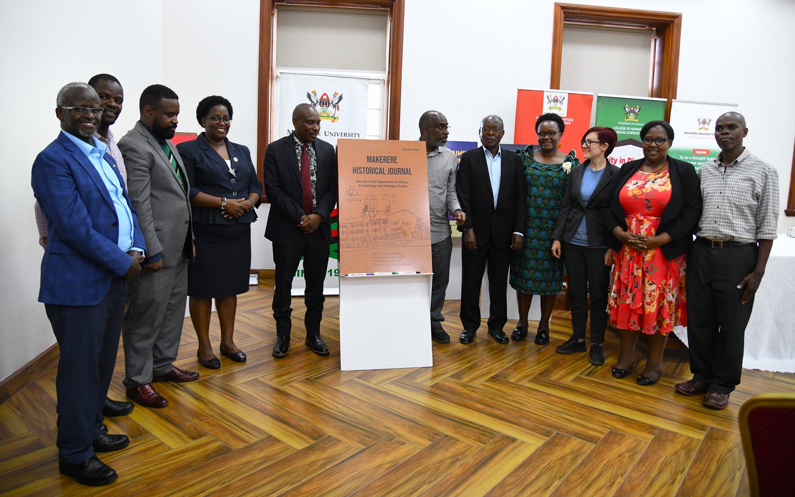 A group photo with the "The Makerere Historical Journal (Vol. 6, No. 1, 2025)" dummy. College of Humanities and Social Sciences (CHUSS) on 11th December 2025 celebrated the launch of five scholarly books, marking a significant milestone in the College’s contribution to academic research and discourse, Senior Common Room, Main Building, Makerere University, Kampala Uganda, East Africa.