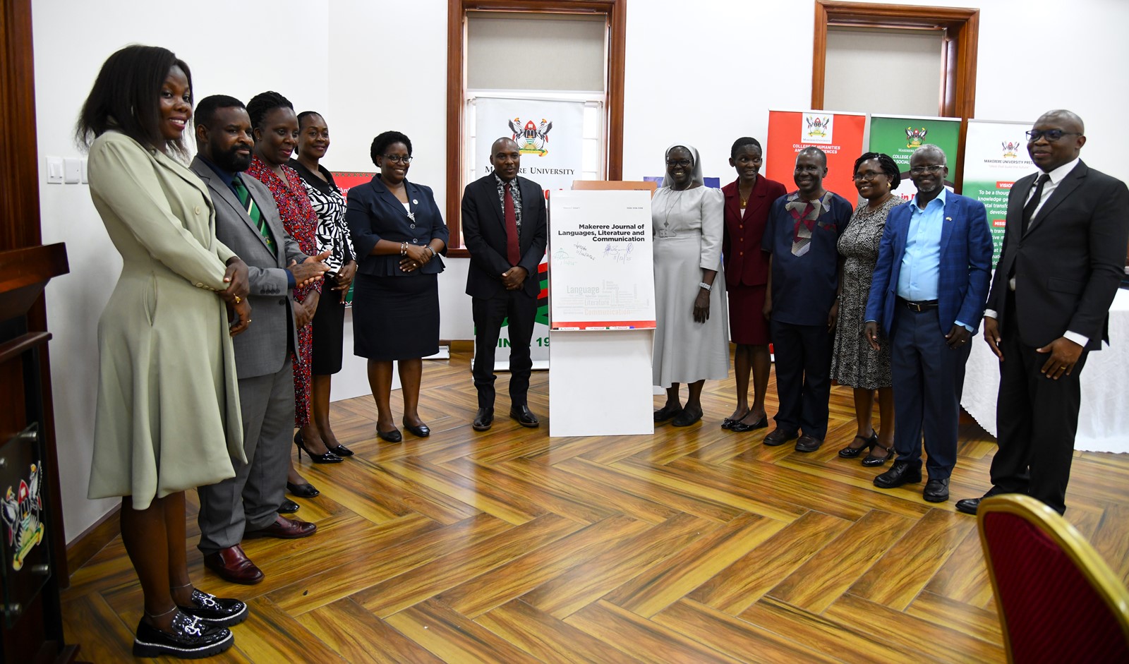 A group photo with the "Makerere Journal of Languages, Literature and Communication (Vol. 1, Issue 1)" dummy. College of Humanities and Social Sciences (CHUSS) on 11th December 2025 celebrated the launch of five scholarly books, marking a significant milestone in the College’s contribution to academic research and discourse, Senior Common Room, Main Building, Makerere University, Kampala Uganda, East Africa.