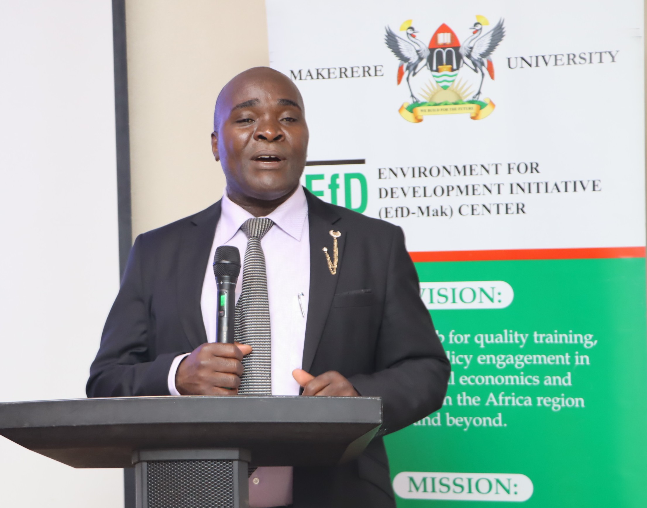 Dr. John Sseruyange delivering the welcome remarks on behalf of the Director EfD-Mak. The high-level annual workshop organised by the Environment for Development (EfD) Makerere University Centre through its regional Inclusive Green Economy (IGE) Programme to draw a roadmap for accelerating the adoption of Climate Smart Agriculture (CSA) as Uganda struggles with rising climate shocks, stagnating agricultural productivity and worsening poverty levels, held on December 4, 2025 at the Sheraton Kampala Hotel, Uganda, East Africa.