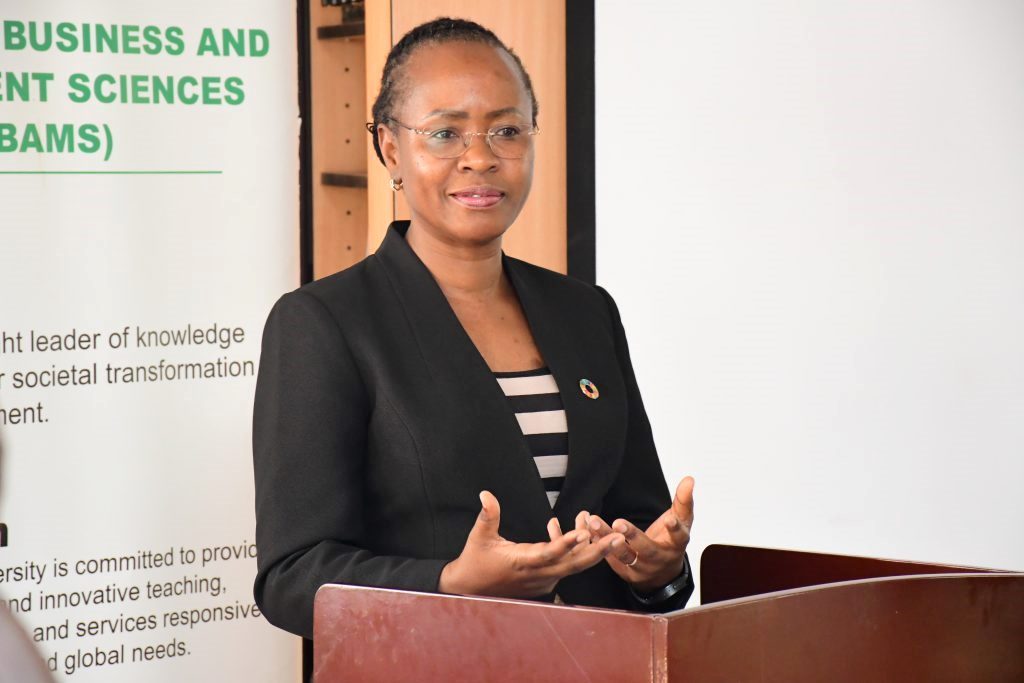 The Makerere University Deputy Vice Chancellor for Academic Affairs, Prof. Sarah Ssali addressing the participants who convened at the CoBAMS Conference Hall to witness the launch of the CoBAMS Working Paper Series. College of Business and Management Sciences (CoBAMS) Working Paper Series 2025 launch by Prof. Sarah Ssali. It consists of over 60 working papers with research set to transform society, inform policy formulation, decision making, governance, development. 4th December 2025, CoBAMS Conference Room, Block B, School of Business, Makerere University, Kampala Uganda, East Africa.