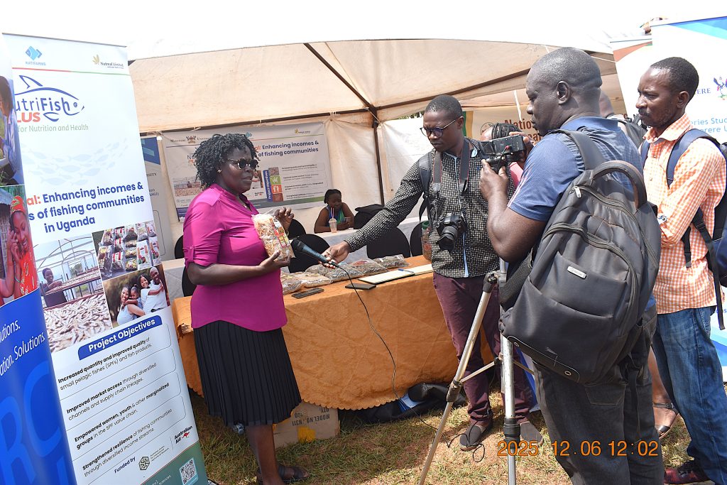 Ms. Nelly Badaru briefing journalists about the NutriFishPlus Project. Makerere University, through the College of Natural Sciences (CoNAS), recognized for its outstanding contribution to the development of the fisheries sector in Uganda, award was presented during the Sustainable Fisheries, Aquaculture, and Environmental Awards Ceremony at the 7th edition of the Jinja Fish Festival, 6th–7th December 2025, Across the Nile Resort, along the banks of the River Nile, Njeru Municipality, Buikwe District, Uganda, East Africa.