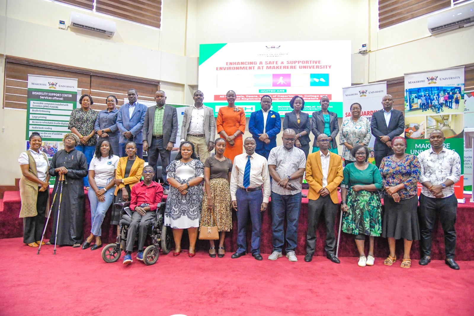 Participants in the training pose for a group photo. Capacity building session on inclusion for Students and Staff with Disabilities organized by the Office of the Dean of Students on Friday December 12, 2025, Makerere University School of Public Health Auditorium, Kampala Uganda, East Africa.